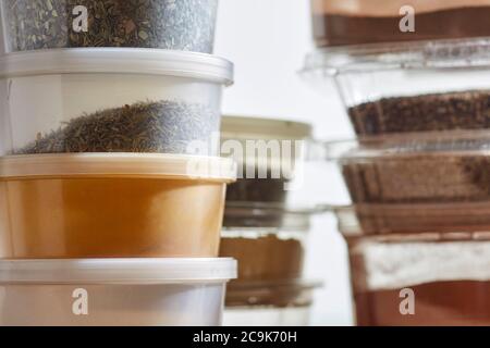 Amish bulk food items. Spices are packed in plastic containers at Amish bulk food stores in Pennsylvania, USA Stock Photo