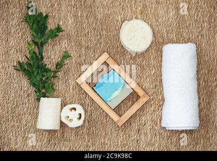 Various spa related objects on straw background. Spa accessories Stock Photo