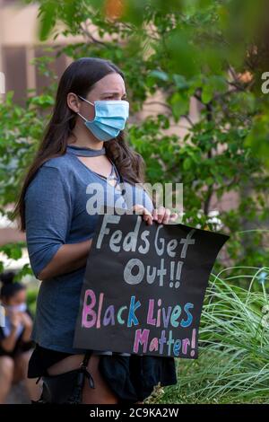 Detroit, Michigan, USA. 31st July, 2020. A rally at the Federal Building opposes President Trump's plan to send federal police to Detroit. Protesters said federal money should instead be used for health and income support during the coronavirus pandemic. Credit: Jim West/Alamy Live News Stock Photo