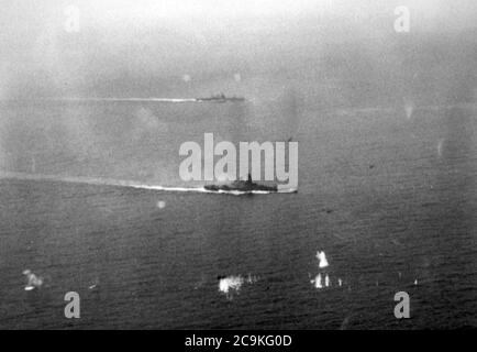 Japanese battleship Yamato and a heavy cruiser underway during the Battle off Samar, 25 October 1944 Stock Photo