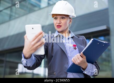 Adult woman architect working with tablet Stock Photo