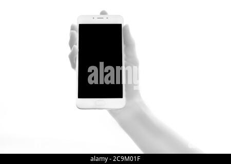 Human bionic hands holding electronic device on white background.  Artificial intelligence futuristic concept Stock Photo