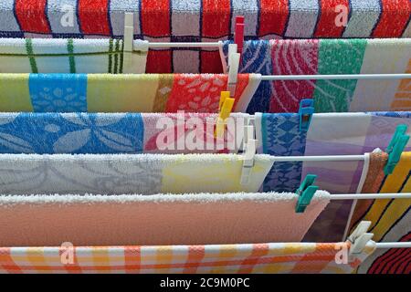 Washed towels on the drying rack Stock Photo