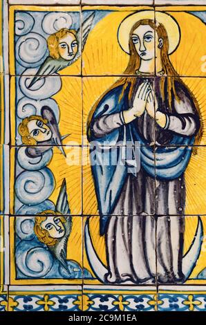 LISBON, PORTUGAL - FEBRUARY 2, 2019: Medieval XIV century set of portuguese azulejo, with painted tiles of a praying virgin mary in Lisbon National Ti Stock Photo