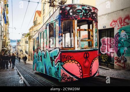 LISBON, PORTUGAL - FEBRUARY 3, 2019: Historic Elevador da Bica, electric elevator in the narrow alleys of Bairro Alto, Lisbon, Portugal, covered by gr Stock Photo