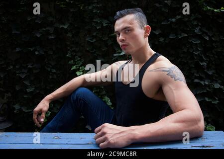 Handsome Latino man from Colombia looks at camera in profile view portrait. Stock Photo