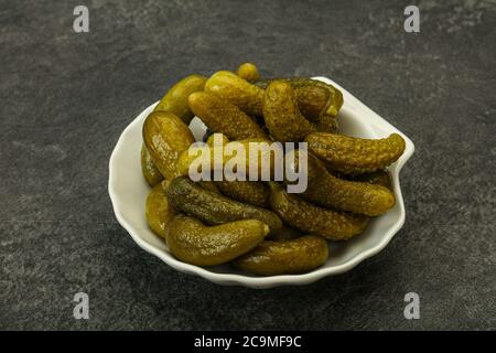 Pickled young gherkin in the bowl Stock Photo