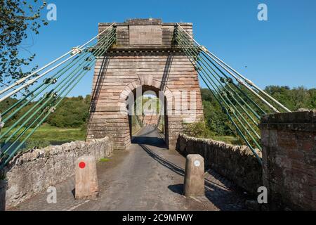 The Union Suspension Bridge which spans the river Tweed between Horncliffe, Northumberland, England and Fishwick, Scottish Borders, Scotland. Stock Photo