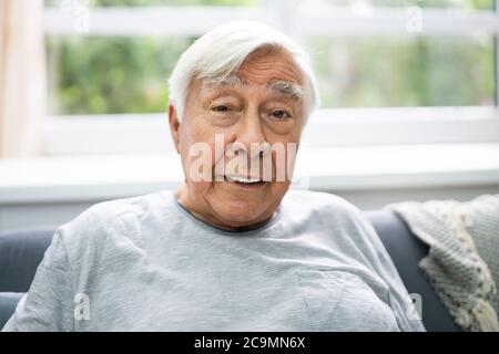 Old Senior Portrait With Gray Hair At Home Stock Photo