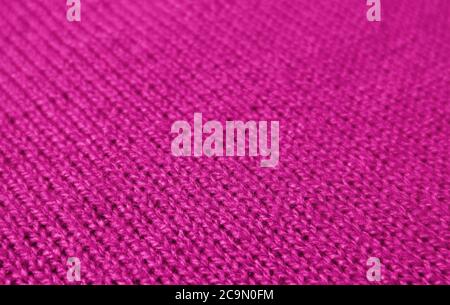 Closeup of Vivid Pink Color Colored Alpaca Knitted Wool Fabric in Diagonal Patterns Stock Photo