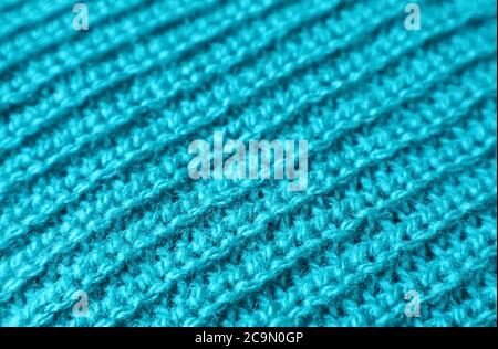Closeup the Texture of Turquoise Blue Alpaca Knitted Wool Fabric in Diagonal Patterns Stock Photo