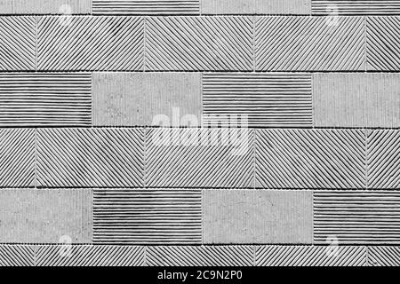 Texture of a wall from a stone tile, a striped pattern of a rectangular tile. Stock Photo