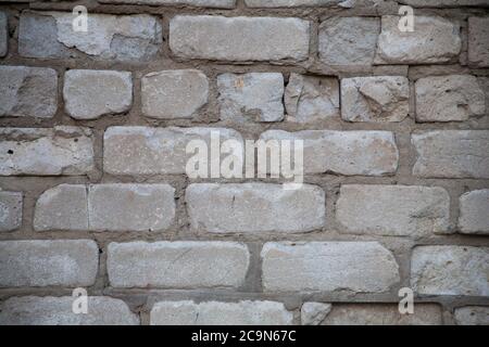 Real old brick wall crumbling from time to time Stock Photo