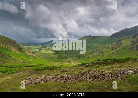 Stormy weather in the English Lake District with heavy thunder showers after warm weather giving a dramatic view over Little Langdale, from Wrynose Pa Stock Photo