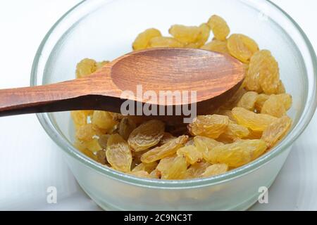 Yellow sultanas raisins isolated on white background cutout Stock Photo