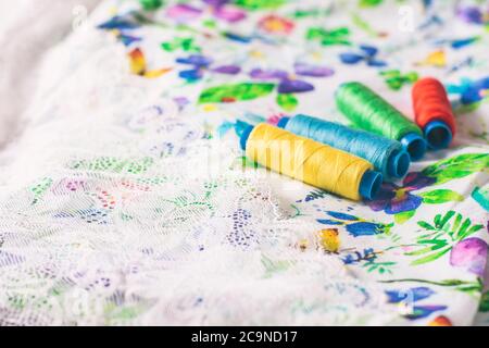 A set of colorful coils on a bright colored fabric. Selective focus. Place for text. Stock Photo