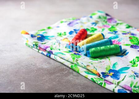 A set of colorful coils on a bright colored fabric. Selective focus. Place for text. Stock Photo
