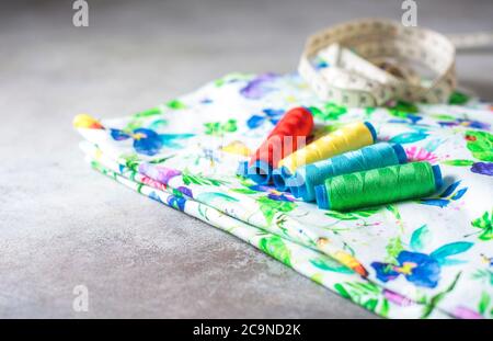 A set of colorful coils on a bright colored fabric. Selective focus. Place for text. Stock Photo