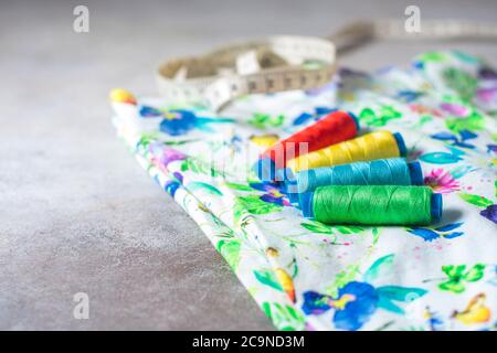 A set of colorful coils on a bright colored fabric. Selective focus. Place for text. Stock Photo