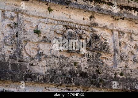 A carved stone Chaac mask in the Nunnery Complex in the ruins of the great Mayan city of Chichen Itza, Yucatan, Mexico. Stock Photo