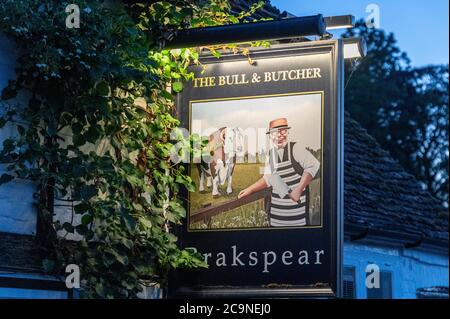 The late daylight summer evenings drawing to a close at the Bull and Butcher public house in the village of Turville in the Chiltern Hills in south Bu Stock Photo