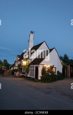 The late daylight summer evenings drawing to a close at the Bull and Butcher public house in the village of Turville in the Chiltern Hills in south Bu Stock Photo