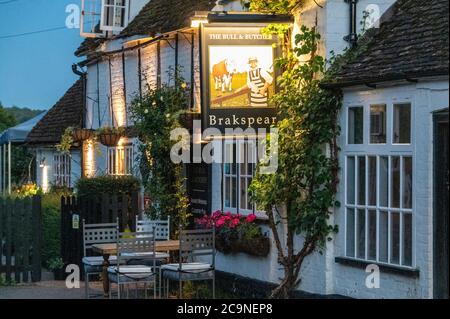 The late daylight summer evenings drawing to a close at the Bull and Butcher public house in the village of Turville in the Chiltern Hills in south Bu Stock Photo