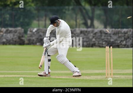 A dove Holes batsman is bowled out during the Derbyshire and Cheshire Cricket League match against New Mills.