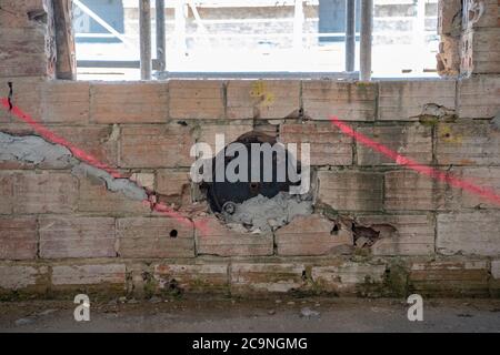 Elstal, Germany. 27th July, 2020. View of a building currently under reconstruction on the site of the Olympic village in Elstal, Brandenburg. Since January 2019, property developer terraplan from Nuremberg has been refurbishing the listed Speisehaus der Nationen including the former boiler house, the future Haus Central. Furthermore, further new residential buildings are being constructed around these buildings. A total of around 365 apartments will be built in the first construction phase until 2022. Credit: Paul Zinken/dpa-Zentralbild/ZB/dpa/Alamy Live News Stock Photo