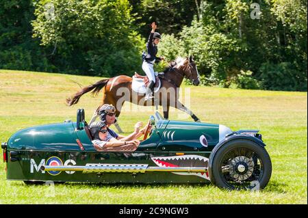Morgan 3-Wheeler racing a horse at the Collings Foundation's Race of the Century event. Stock Photo