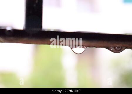 Water drop on window rod Stock Photo