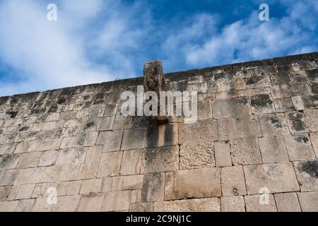 The carved stone ring set high in the wall of the Great Ball Court in the ruins of the great  Mayan city of Chichen Itza, Yucatan, Mexico. Stock Photo