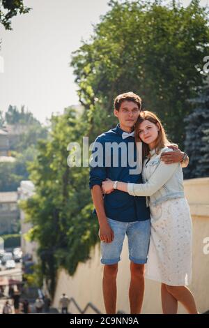 Happy stylish loving couple of hipsters hugging in a park Stock Photo