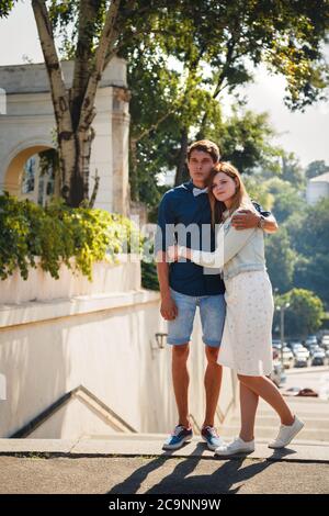 Happy stylish loving couple of hipsters hugging in a park Stock Photo