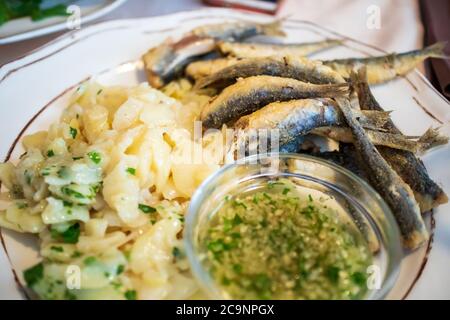 Grilled Sardines on a plate in a restaurant Stock Photo