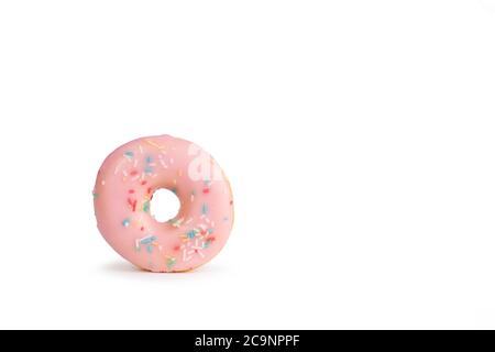 fresh pink donut with sprinkles isolated on white background with soft shadow Stock Photo