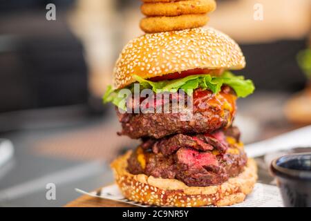 Double Steak Burger served in a restaurant, close-up Stock Photo