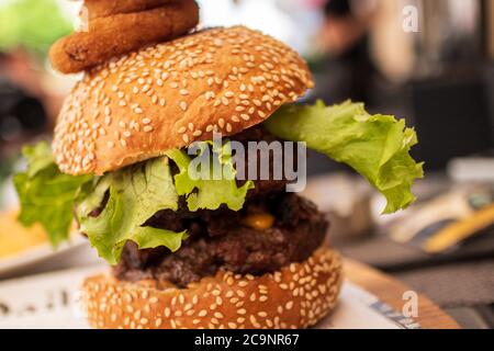 Double Steak Burger served in a restaurant, close-up Stock Photo