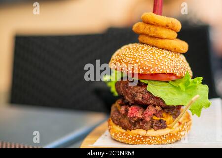 Double Steak Burger served in a restaurant, close-up Stock Photo