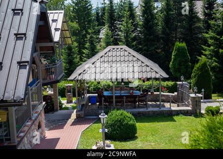 Zlatibor, Serbia - July 25. 2020 Yard of the house and beautiful garden on the mountain resort on a sunny summer day Stock Photo