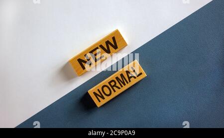 NEW NORMAL words on wooden blocks. New normal concept. Beautiful wooden background. Stock Photo