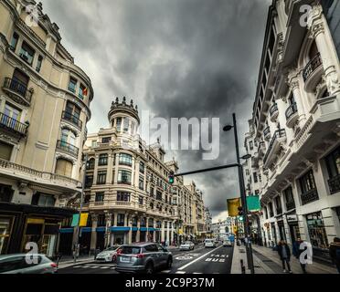 Dramatic sky over Gran Via boulevard in downtown Madrid, Spain Stock Photo