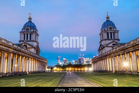 The historic Chapel architecture of St Peter and St Paul old Naval Royal College against the city of London at dusk Stock Photo