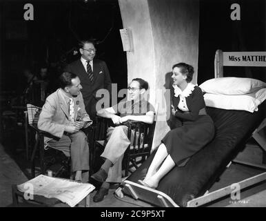Associate Producer SHAN BALCON Musical Director LOUIS LEVY Director SONNIE HALE and JESSIE MATTHEWS on set candid during filming of HEAD OVER HEELS aka HEAD OVER HEELS IN LOVE 1937 Gaumont British Picture Corporation Stock Photo