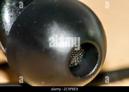 Extreme close up of a black earbud Stock Photo