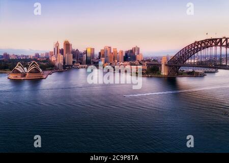 Circular quay waterfront in Sydney city - aerial elevated view at sunrise. Stock Photo