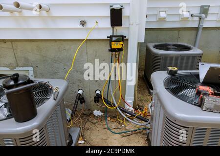 New air conditioner during the installation process preparing to industry system install vacuum pump checking Stock Photo