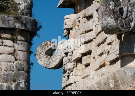 A Chaac mask on the facade of the Iglesia or Church in the Nunnery Complex in the ruins of the great Mayan city of Chichen Itza, Yucatan, Mexico. Stock Photo