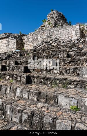 The stairway to one of the partially restored ruins of the twin temples on Structure 17 in the ruins of the pre-Hispanic Mayan city of Ek Balam. Stock Photo
