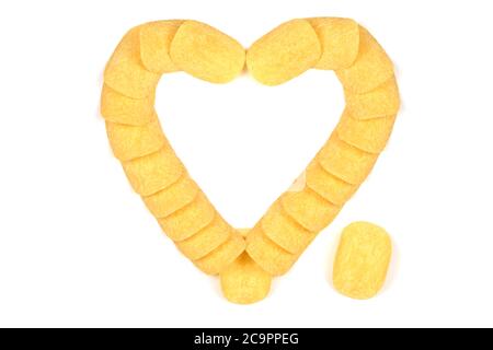 Tasty crispy potato chips in heart shape isolated on white background. High resolution photo. Full depth of field. Stock Photo